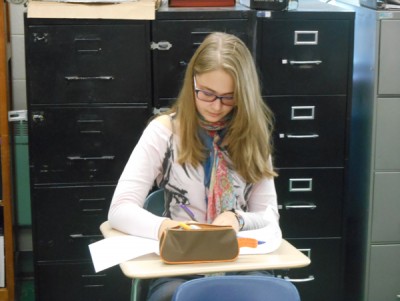 Foreign exchange student Sia Skoryk completes homework in her first period class.