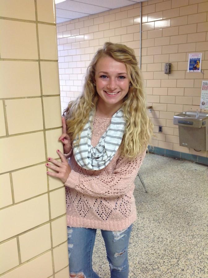 Sophomore Claire Pilgrim is ready for Fall in an oversized sweater and scarf.