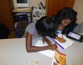 Juniors Akilah Parker and Bethel Aseffa pose as cheaters.