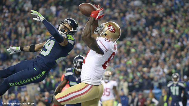 San Francisco 49ers wide receiver Anquan Boldin catches a touchdown pass over Seattle Seahawks free safety Earl Thomas during the NFC Championship playoff game between the San Francisco 49ers against the Seattle Seahawks on Sunday, Jan. 19, 2014 in Seattle, WA. The Seahawks and 49ers will meet again on Thanksgiving. Photo courtesy of The Associated Press (Tom Hauck)