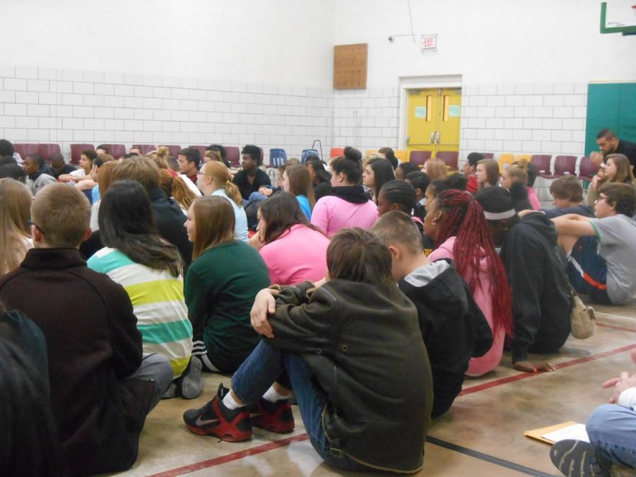 Freshmen sit in the small gym, listening to one of the talks during Unity Day (photograph by senior Amari McCain).