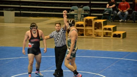 Senior Ryan Cloud being announced as winner over his Tecumseh High School opponent (Photo courtesy of northmontathletics.com).