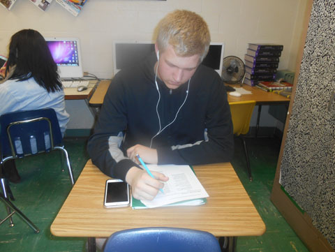 Sophomore Michael Wright listens to his music while working on an assignment