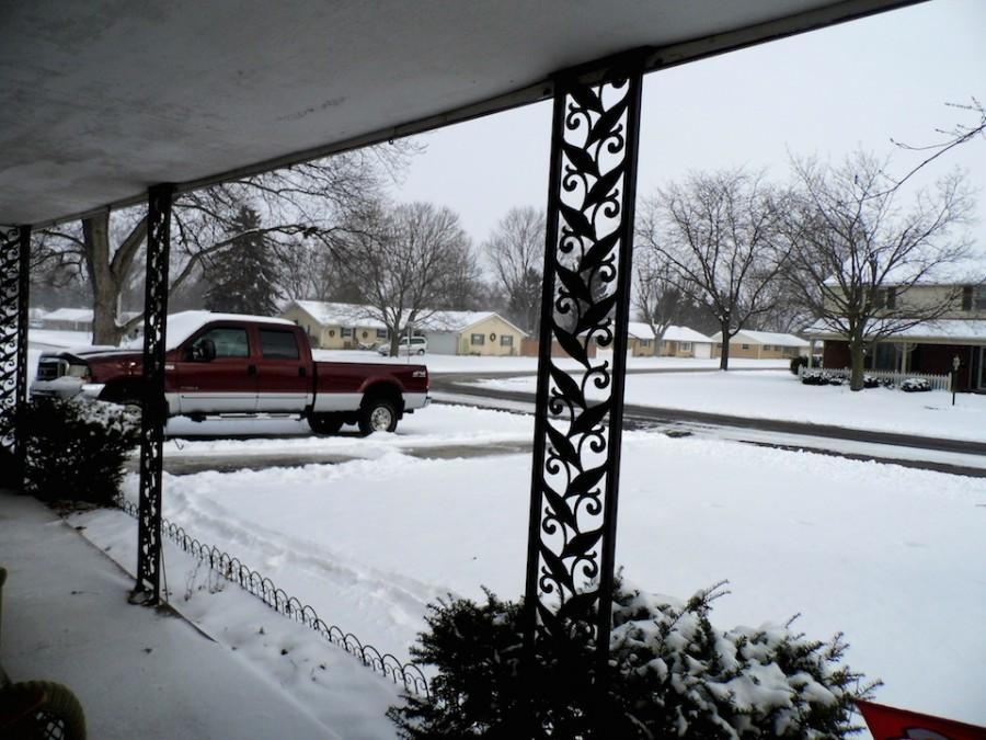 Sia Skoryk looks out the front door of her host familys home in Englewood on a January Snow Day.