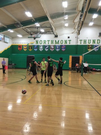 The team celebrate after scoring a point against rivals Centerville. Photo Courtesy of: Northmont Yearbook