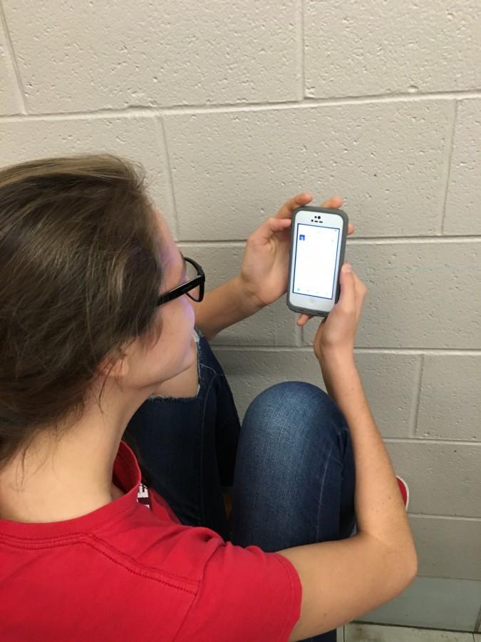 Sophomore Cecelia Stebel reads a tweet that says girls that can dance [are] always winning.