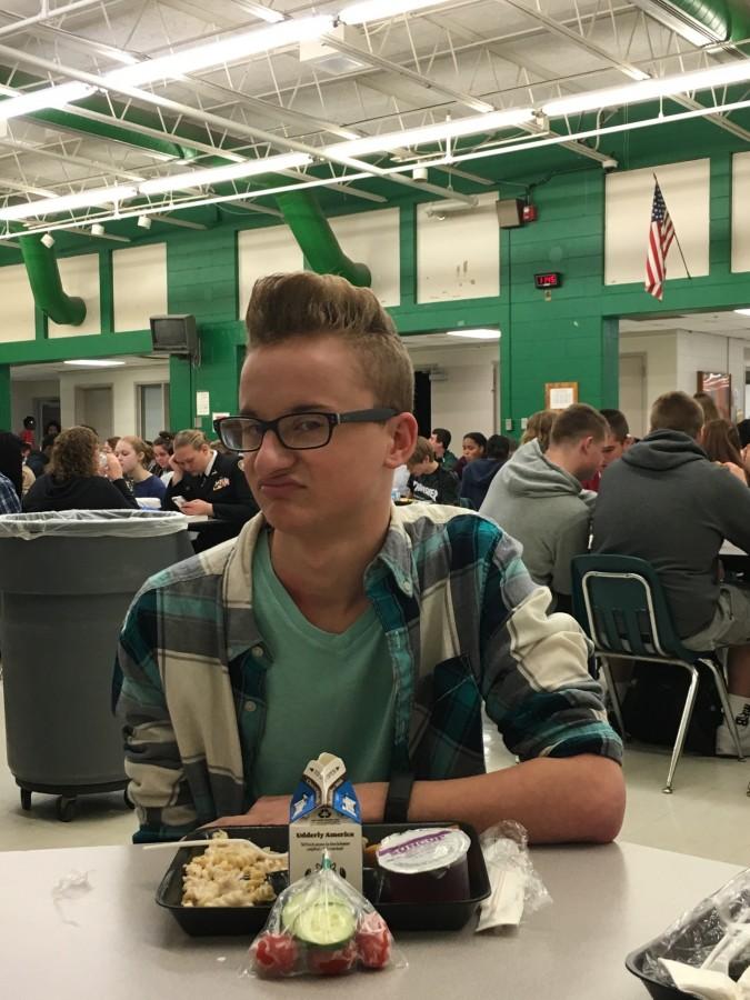 Senior Austin Newell looks disgusted about the chicken alfredo that is served too often. 