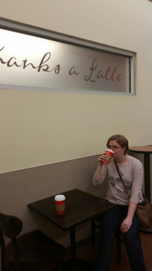 Newspaper irregular senior Meghan Jenkins sips from the controversial red cup in a nearby Starbucks.