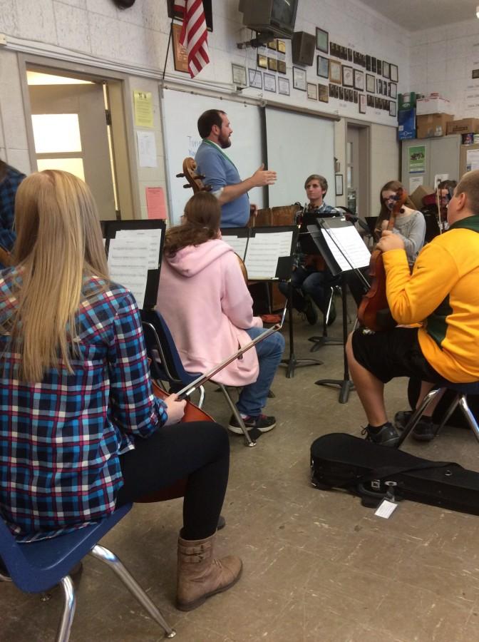 Mr. Ryan Chatterton meets with his fifth period orchestra class in the VMR.