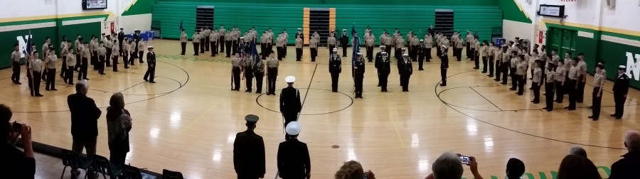 The ROTC unit marches around the gym, going into their ending position, as AMI comes to a close.