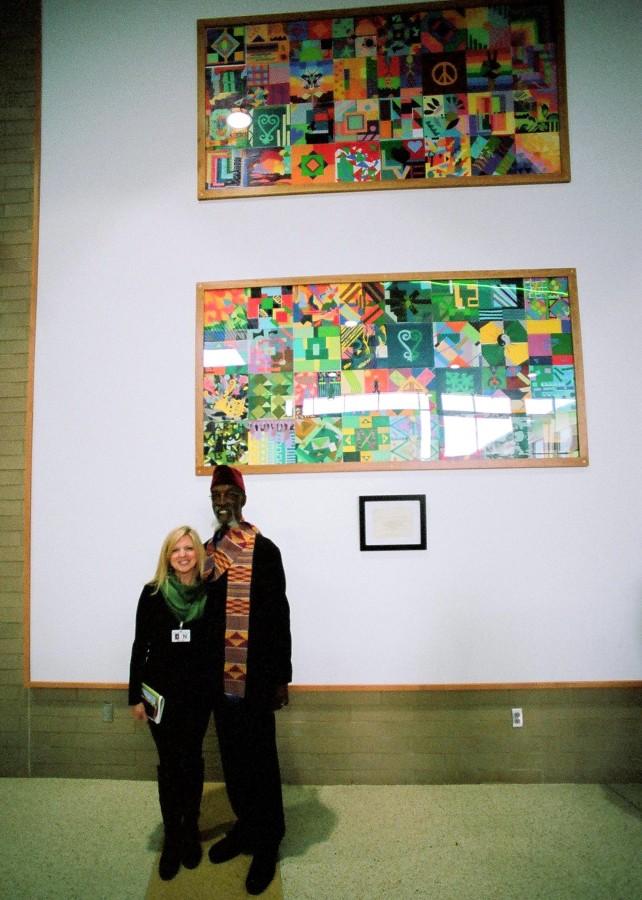 Art teacher Ms. Bethany Allen and Bing Davis stand in front of the permanent art piece in the new high school (Photo courtesy of Mr. Steve Shaw).