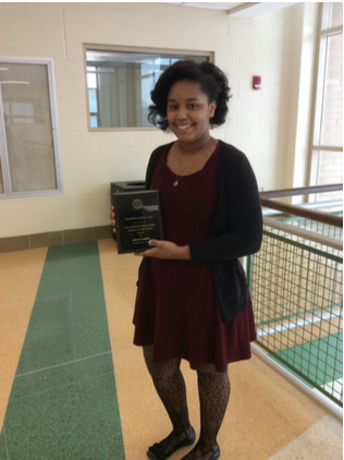 Senior Jaelynn Gordon holds her Rotary Club Student of the Month plaque, awarded on February 9.
