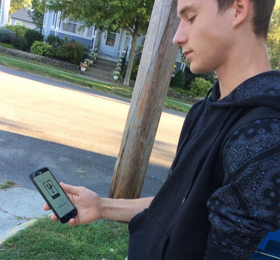 Freshman Levi Vangorden plays Pokémon Go.