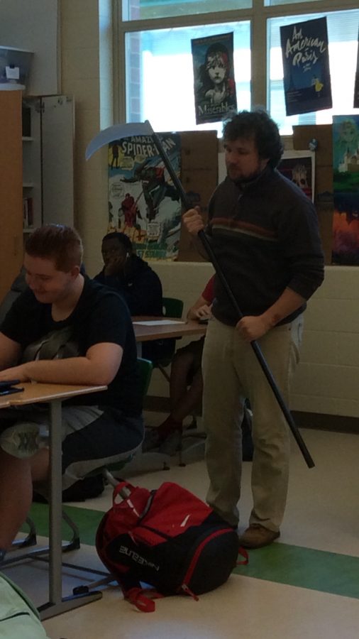 Mr. Ranger Puterbaugh critiques his students work. 