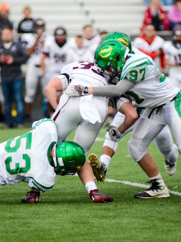 Freshmen Bryce Asher and Nick Henderson make a tackle in their defeat at Butler.