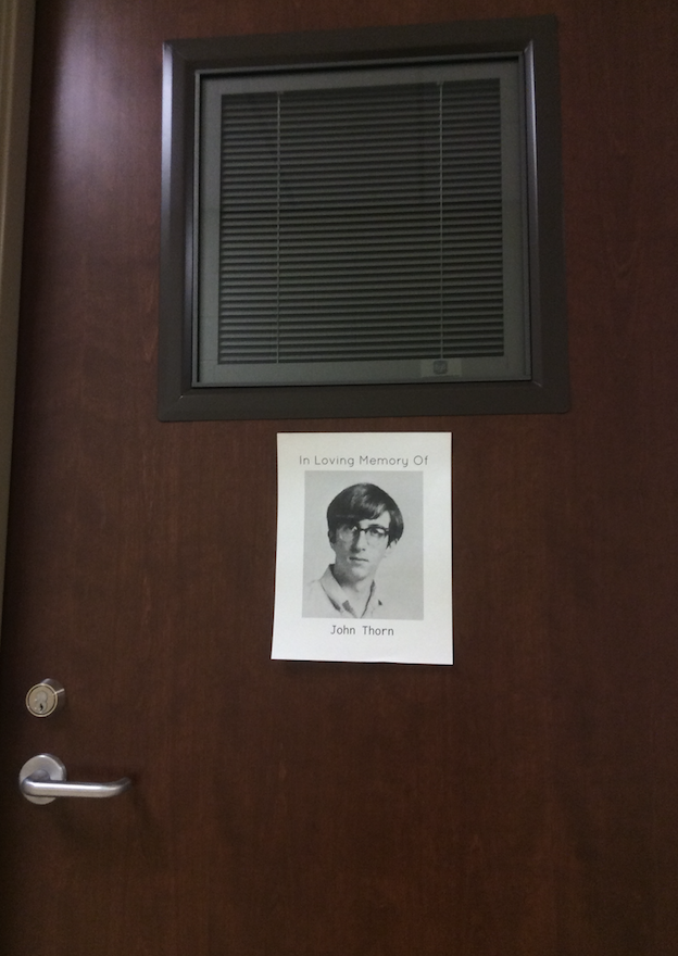 Mr. John Thorns door is decorated in his memory with his high school senior picture.