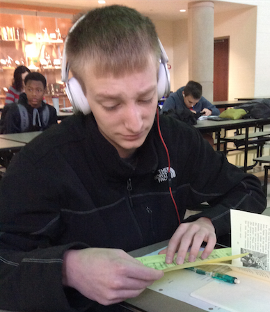 Sophomore Bradlee Fritz examines the misprinted information with confusion.