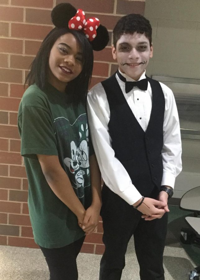 Junior Sasha Spencer and junior Jayson Aguilar dress as Minnie Mouse and a calavera (a Day of the Dead costume) for Costume Day at the high school.