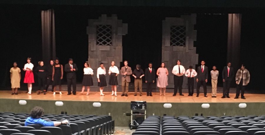 The cast of The Crucible lines up for mic check.
