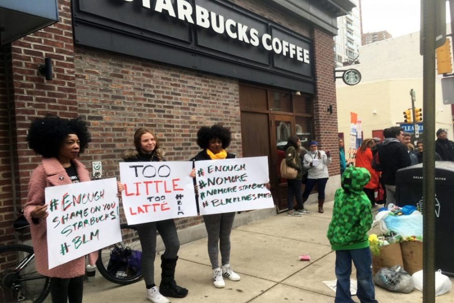 People protesting outside a Starbucks location (courtesty of WBUR.com).