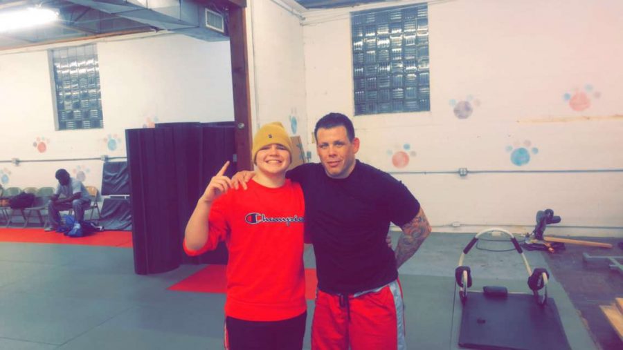 Bryce Asher poses with professional UFC fighter Sean Salmon