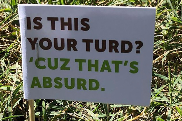 One of the many “Is this your turd?” Poop Flags.