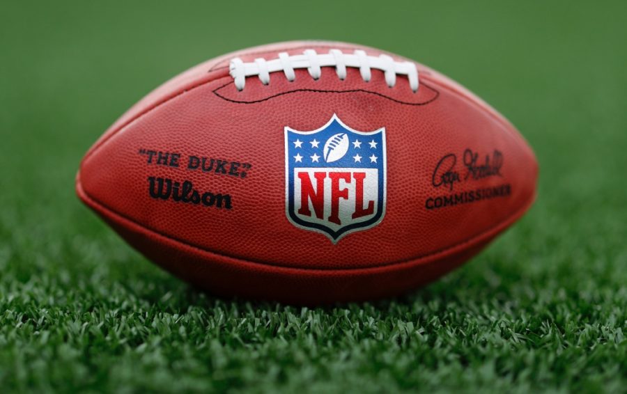 A detail view of a football is seen on the field Tuesday, May 5, 2020, in Houston. (Aaron M. Sprecher via AP)