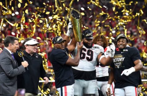 Georgia celebrating with the CFP National Championship Trophy vis Google Images 