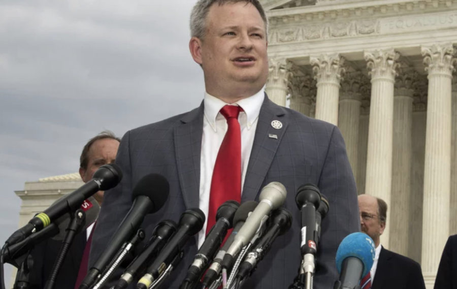 South Dakota Attorney General Jason Ravnsborg speaks to reporters in front of the U.S. Supreme Court in Washington on Sept. 9, 2019. 
