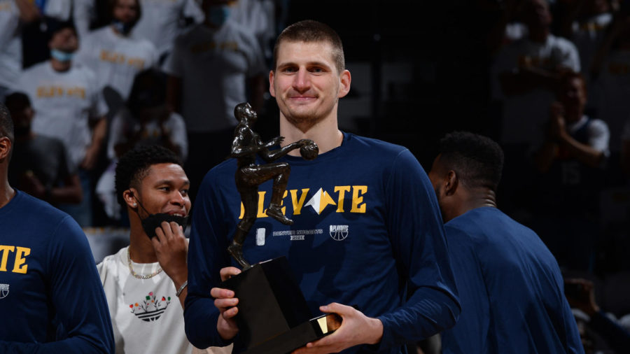 DENVER, CO - JUNE 11: Nikola Jokic #15 of the Denver Nuggets received the Maurice Podoloff Trophy as the 2020-2021 Kia NBA Most Valuable Player before the game against the Phoenix Suns during Round 2, Game 3 of the 2021 NBA Playoffs on June 11, 2021 at the Ball Arena in Denver, Colorado. NOTE TO USER: User expressly acknowledges and agrees that, by downloading and/or using this Photograph, user is consenting to the terms and conditions of the Getty Images License Agreement. Mandatory Copyright Notice: Copyright 2021 NBAE (Photo by Bart Young/NBAE via Getty Images)