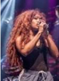 SZA performing on stage in 2018