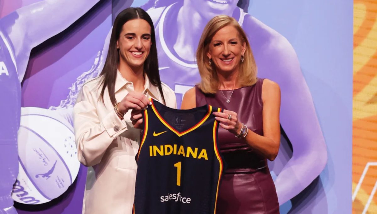 Caitlin Clark pictured next to the WNBA commissioner Cathy Engelbert after being the No.1 overall pick.