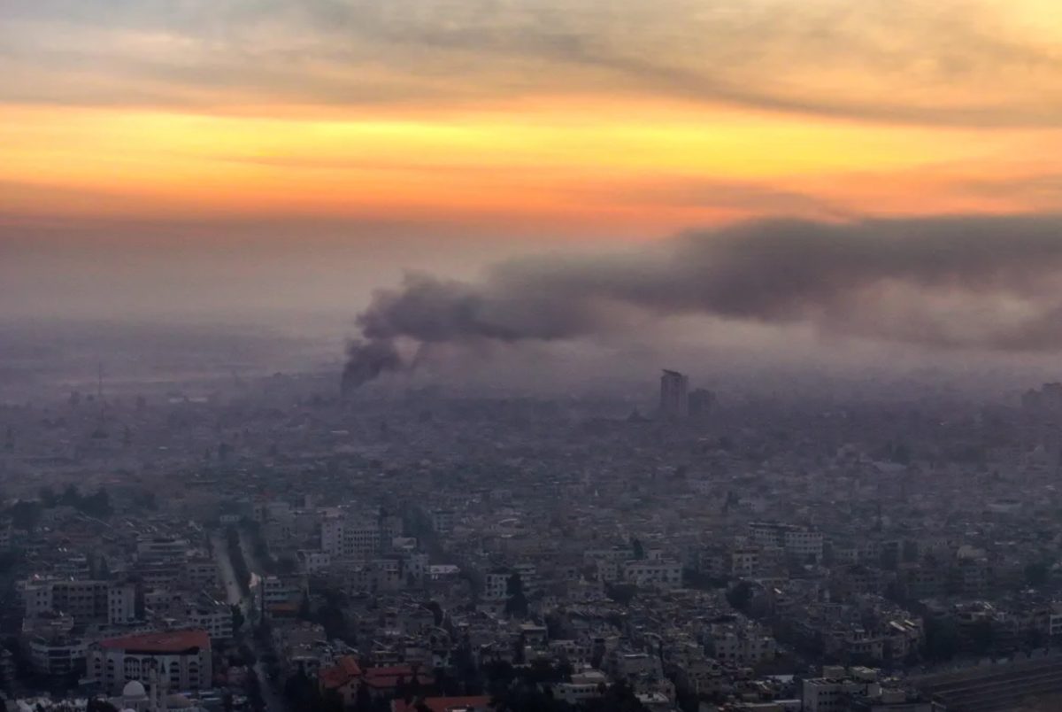 Smoke billows following Israeli airstrikes in Damascus on December 10. 