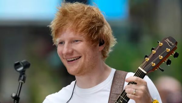 Ed Sheeran performing on a street in Bengaluru, India, when the performance was cut short by a police officer. ( February, 10, 25 | Charles Sykes / Invision / The Associated Press ).