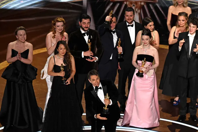 The cast and crew of Anora accepting the Oscar for Best Picture