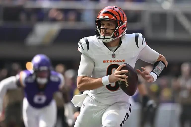 Jake Browning evading defenders 