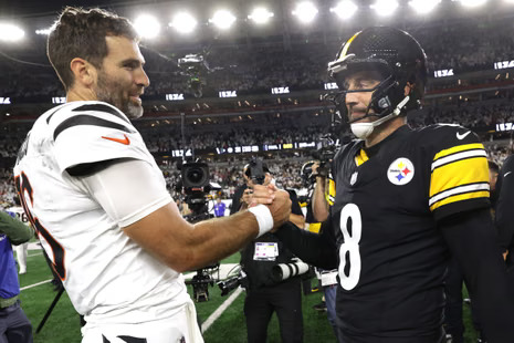 Joe Flacco and Aaron Rodgers after game 