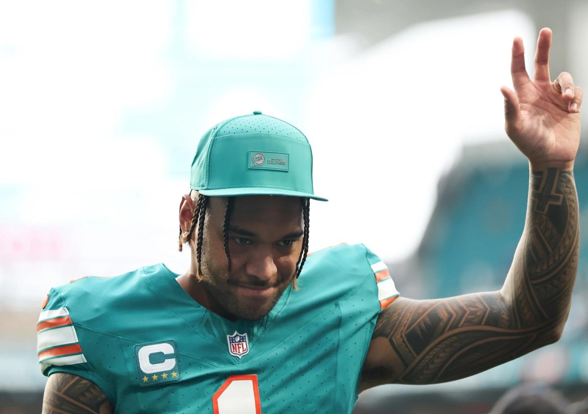 MIAMI GARDENS, FLORIDA - DECEMBER 21: Tua Tagovailoa #1 of the Miami Dolphins waves to fans after his team's 45-21 loss against the Cincinnati Bengals at Hard Rock Stadium on December 21, 2025 in Miami Gardens, Florida. 